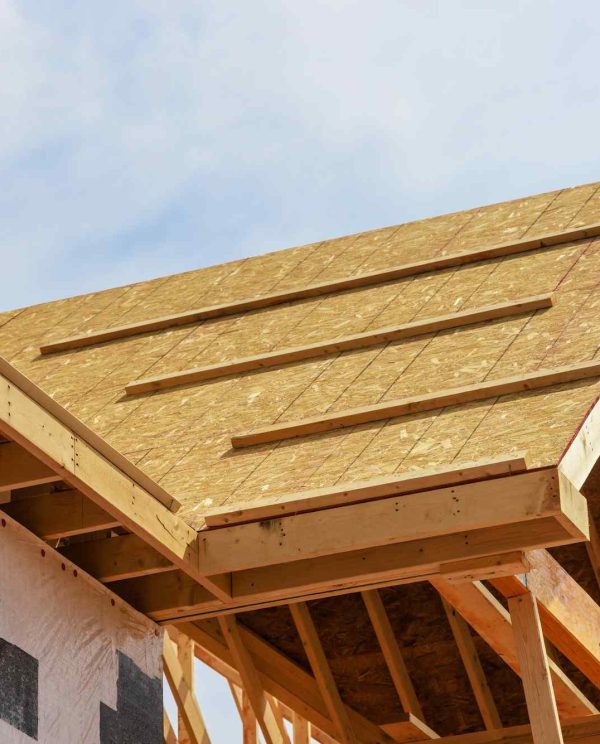 Developing a new house. Roof structure with wooden shingles.