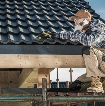 Roof Construction Worker Making Phone Call While Staying on Scaffolding.